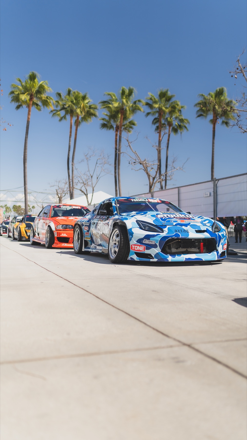 Drift cars lined up in the paddock