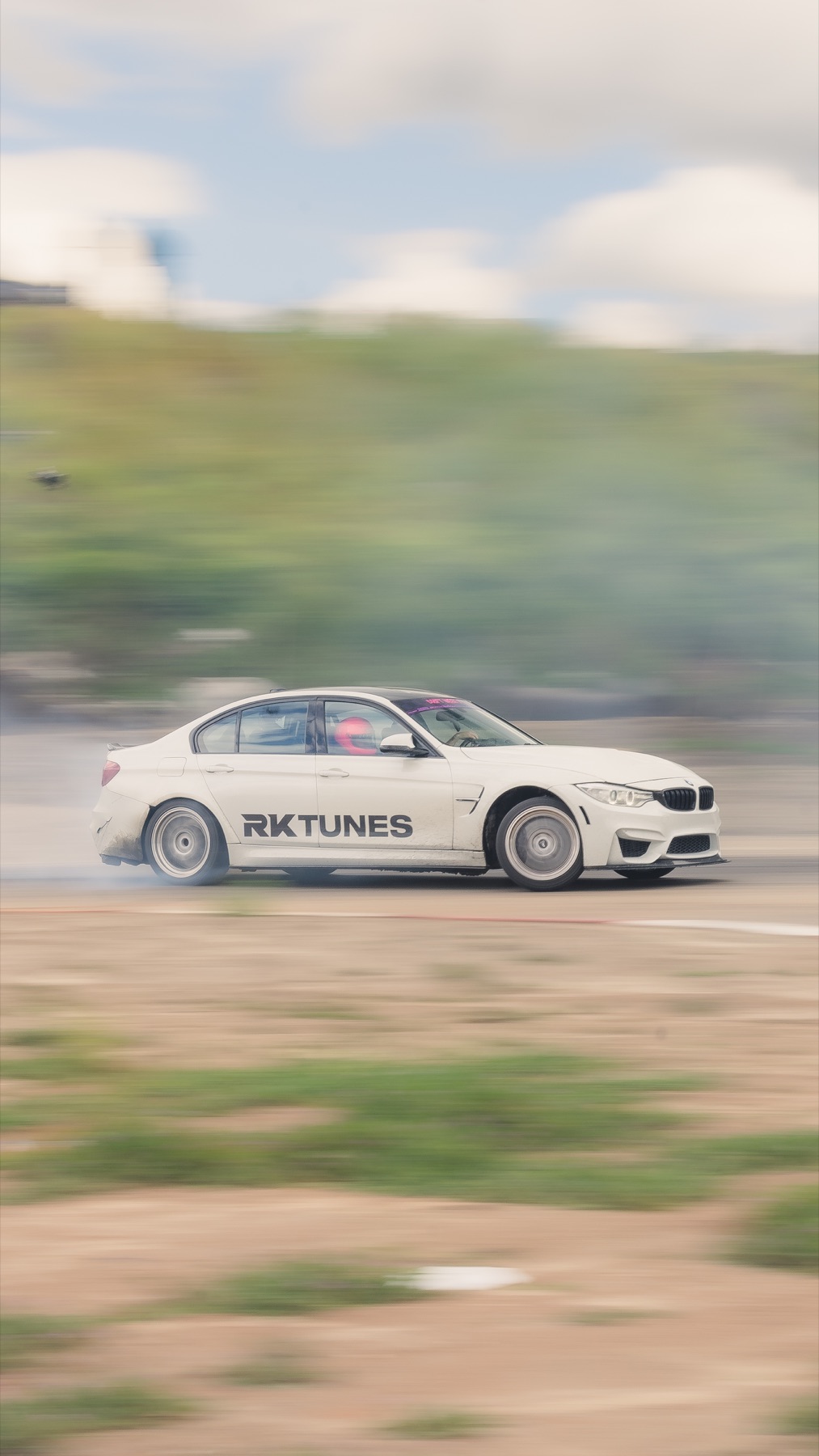 M3 mid-drift on a dusty track